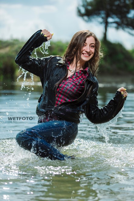 Swimming By Happy Girl In Soaking Wet Jeans Leather Jacket And Shoes