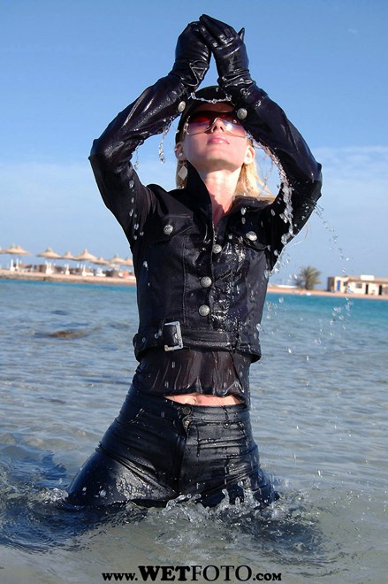 #1 - Wetlook by Sexy Blonde Girl in Black Jacket and Leggings by the Sea