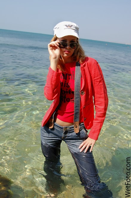 wet girl get wet wet hair swim fully clothed jacket t-shirt jeans shoes baseball cap sea