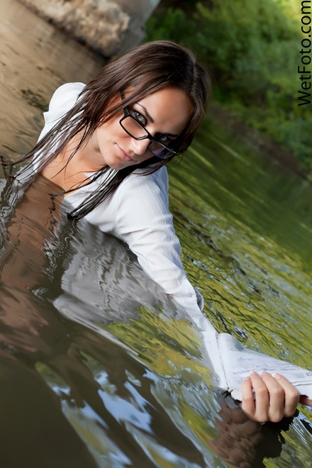 brunette wet woman get wet wet hair fully clothed shirt skirt stockings high heels glasses notebook river