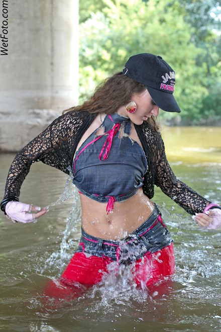 wet girl get wet wet hair fully clothed leggings top denim shorts gloves socks baseball cap river