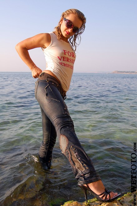 wet girl wet hair get wet swim fully clothed t-shirt jacket tight jeans high heels sandals fully soaked sea
