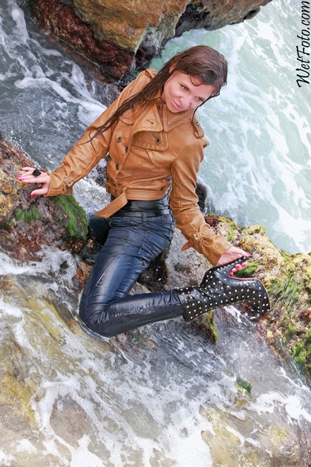 wet girl get wet wet hair swim fully clothed leather jacket tight jeans stockings high hells boots sea