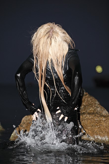 blonde wet girl get wet fully clothed jacket leggingshigh heels boots wet hair sea