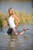 blonde wet girl wet hair get wet fully clothed t-shirt jacket leggings high heels lake