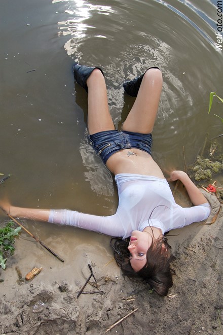 wet girl get wet wet hair fully clothed golf shorts denim leather jackboots lake