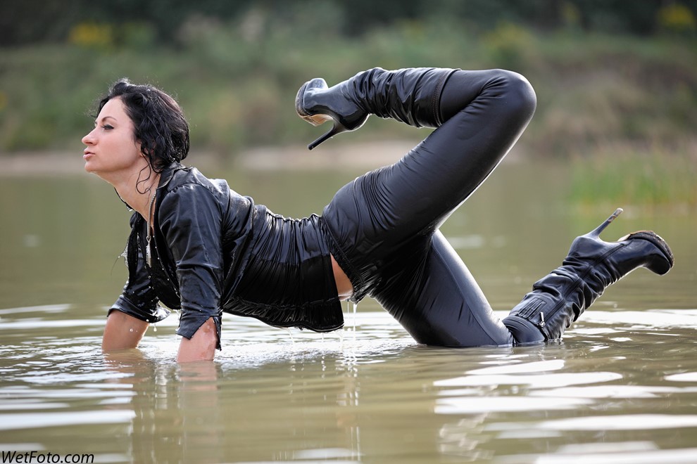 brunette wet girl wet hair get wet fully clothed corset leggings leather mantle high heels boots lake