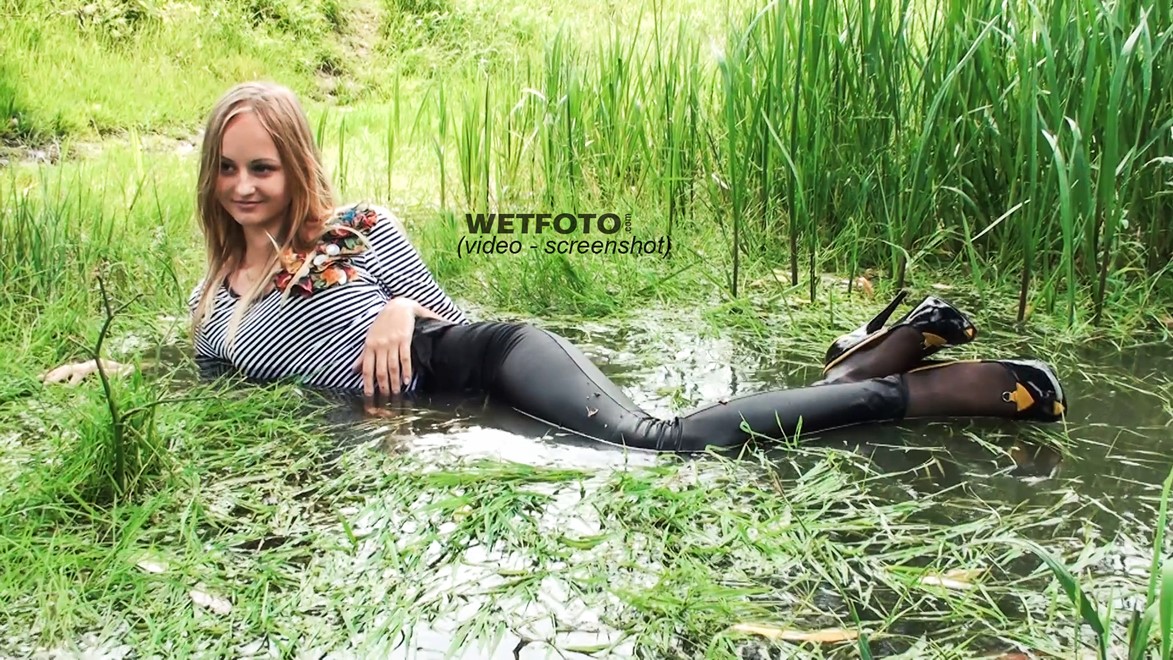 wet girl get wet wet hair fully clothed leggings tights blouse high heels lake
