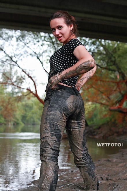 wet girl get wet fully clothed fully clothed jeans blouse skirt leggings evening gloves shoes mud