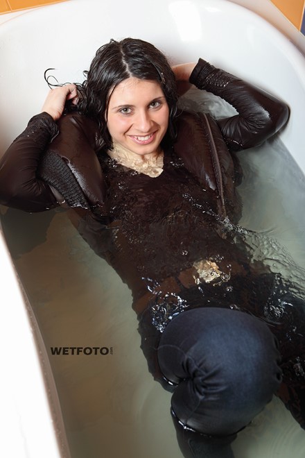 wet woman get wet wet hair fully clothed jacket sweater jeans boots bath