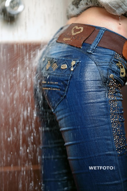 wet girl get wet wet hair fully clothed jacket sweater jeans high heels boots jacuzzi