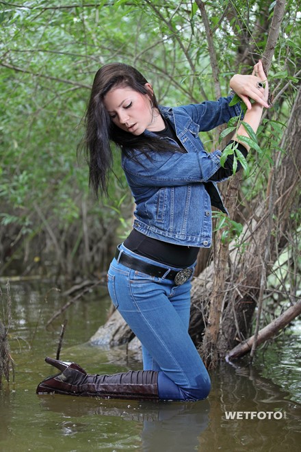 wet girl brunette get wet fully clothed skinny jeans jacket denim tights leather boots heels lake