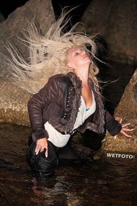wet girl blonde sheepskin coat brown leggings boots high heels hat wet hair get wet soaked swimming fully clothed sea