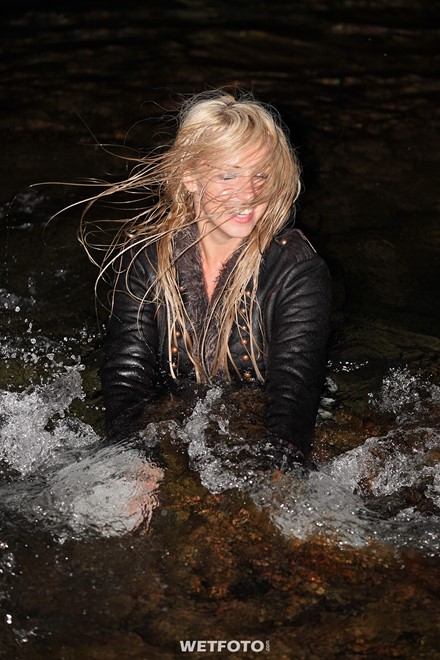 wet girl blonde sheepskin coat brown leggings boots high heels hat wet hair get wet soaked swimming fully clothed sea