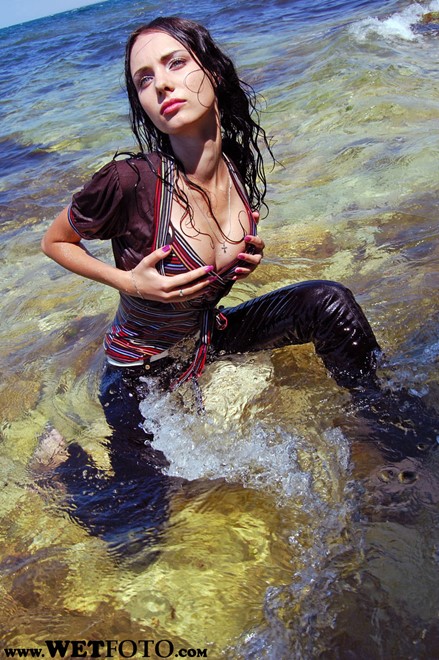 wet girl wet hair get wet striped blouse tight pants high heels fully soaked sea