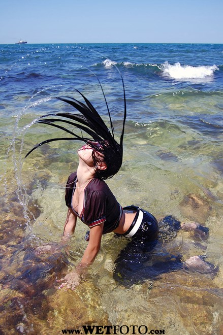 wet girl wet hair get wet striped blouse tight pants high heels fully soaked sea