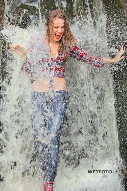 wet girl wet hair get wet shirt tight jeans sneakers water waterfall