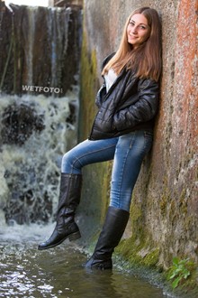 #339 - Fully Dressed Girl in Jacket, Jeans and Leather Boots Get Soaking Wet under Waterfall