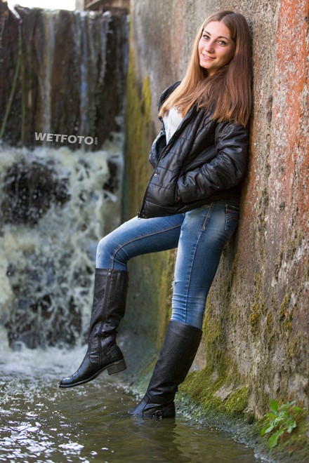 wet girl wet hair get wet sweater jacket tight jeans leather boots waterfall