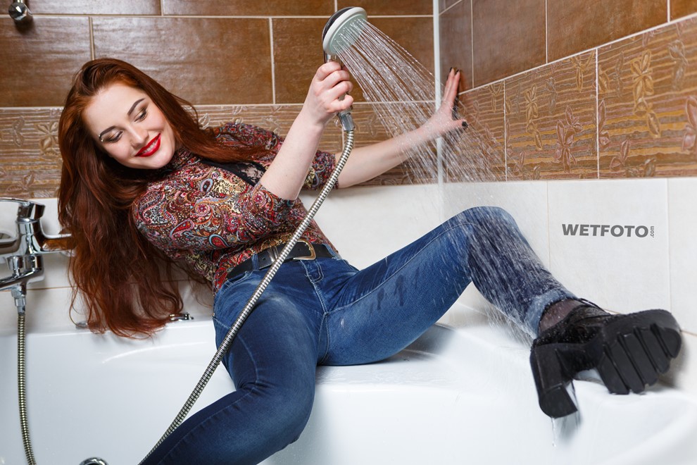 wet girl fully clothed wet get wet soaking wet colorful golf jeans boots jacuzzi