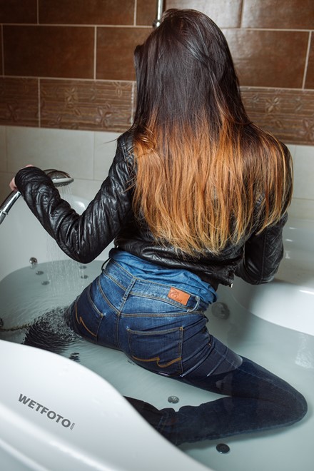 wet girl fully clothed get wet soaking wet denim shirt leather jacket jeans boots jacuzzi