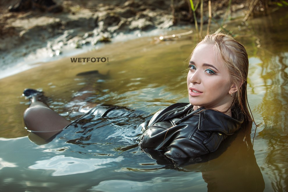wet girl soaked get wet swimming fully clothed tights leather jacket skirt high heels lake