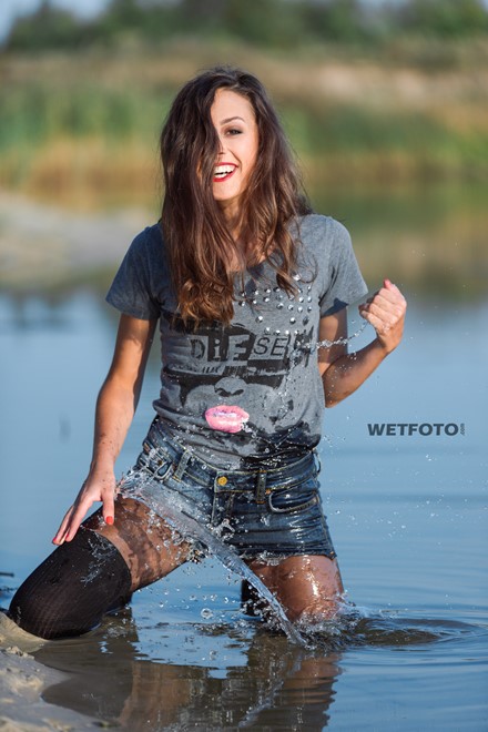 wet girl get wet water t-shirt denim shorts stockings sneakers wet hair soaked