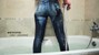 wet girl get wet soaking fully clothed jeans shirt socks wet hair bath