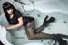 wetlook wet girl takes a bath shower clothes wearing wet black bodysuit tattoo jeans shorts nylons shoes wetfoto