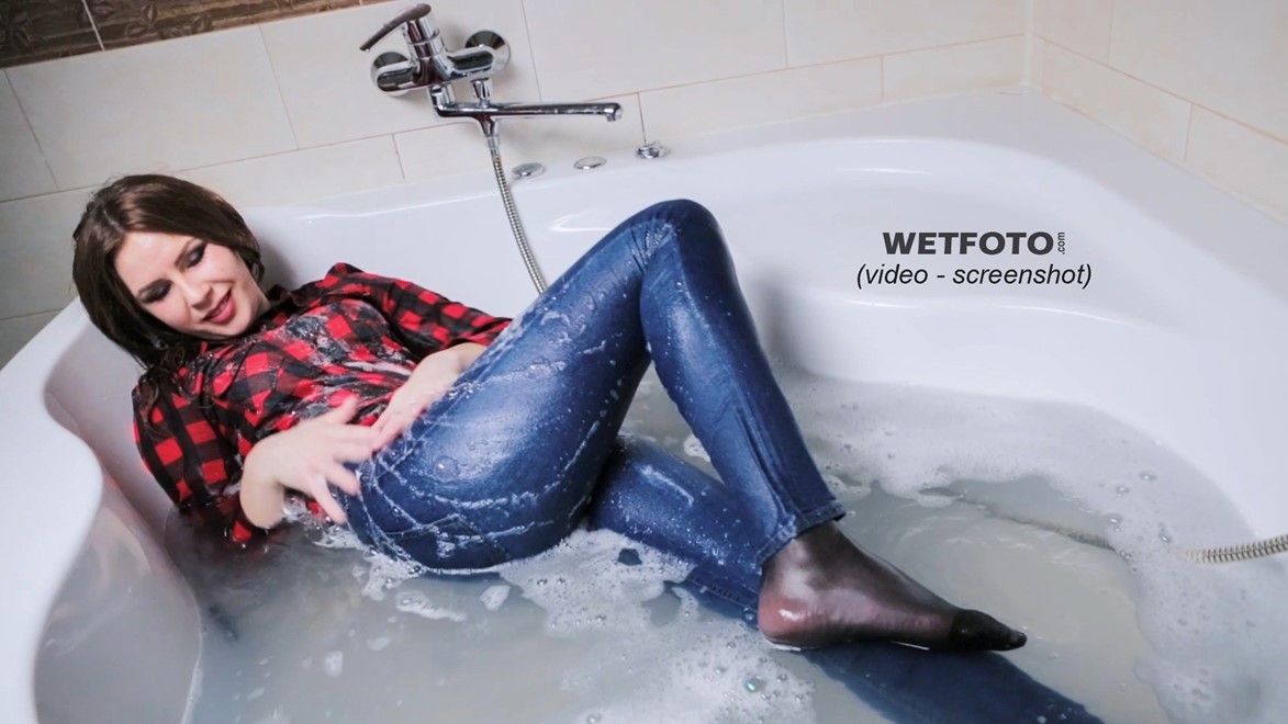 wet girl fully clothed jeans shirt jacket leather high heels boots wet hair bath