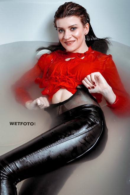 wetlook girl get wet fully clothed bathroom takes shower shiny faux leather pants