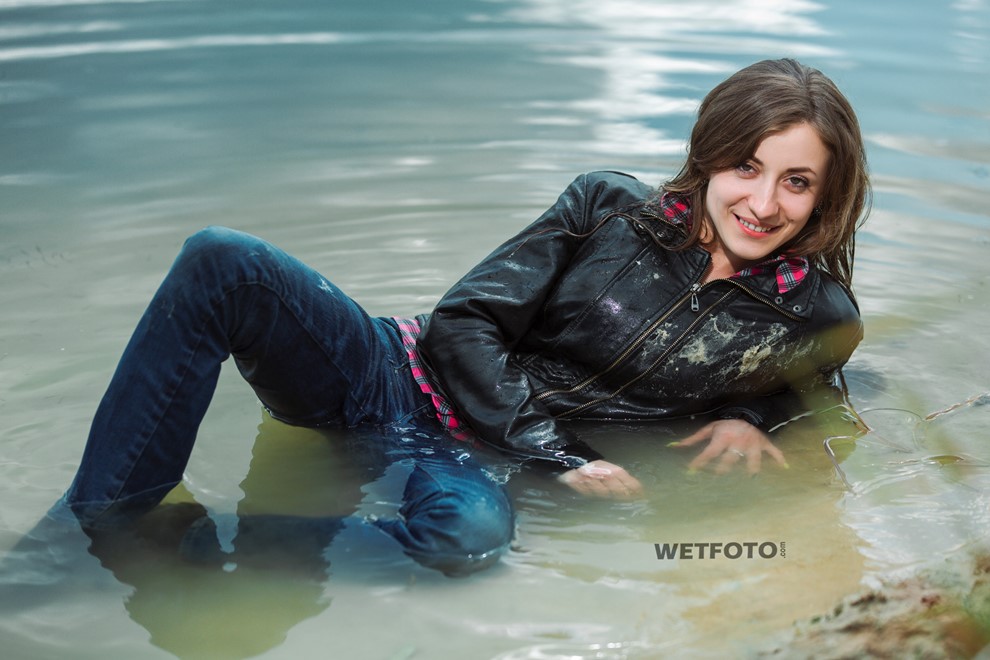 wet girl get wet jacket jeans leather shirt shoes high heels tights fully clothed water swim lake