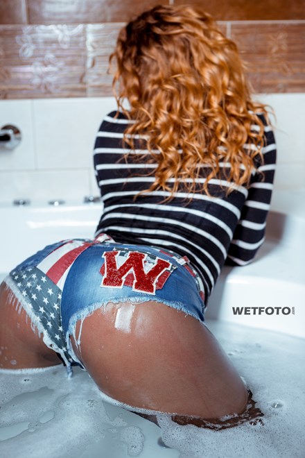 store wetfoto wetlook girl denim shorts tights get soaking wet jacuzzi bath