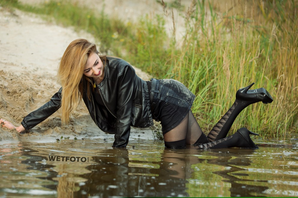 wet girl get wet faux leather jacket bodysuit jeans skirt tights gaiters shoes high heels wet hair lake