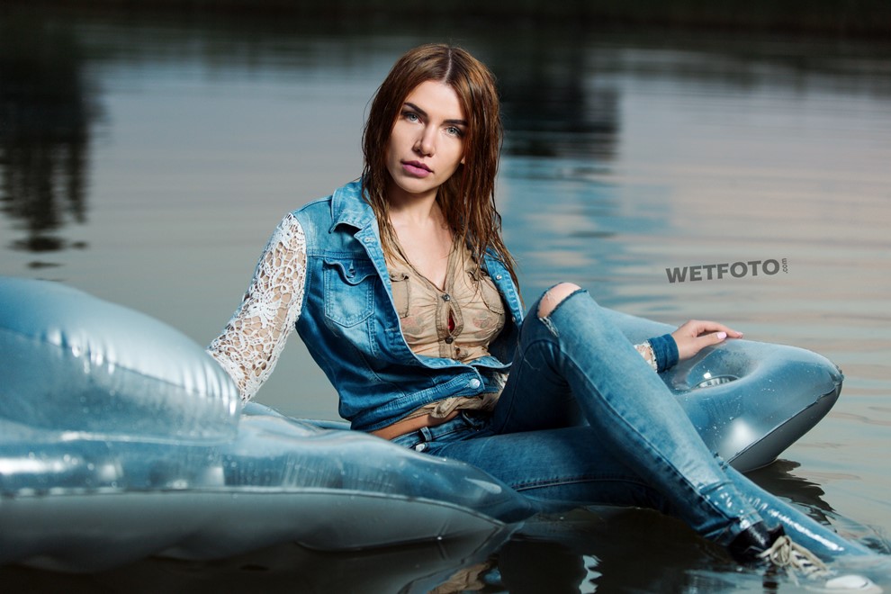 wet girl get wet jacket skinny jeans socks sneakers wet hair lake