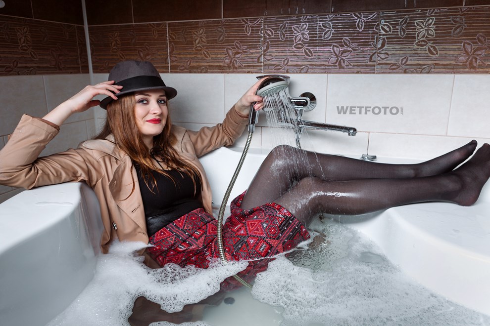 wetfoto wetlook fully clothed girl coat hat get soaking wet bubble bath