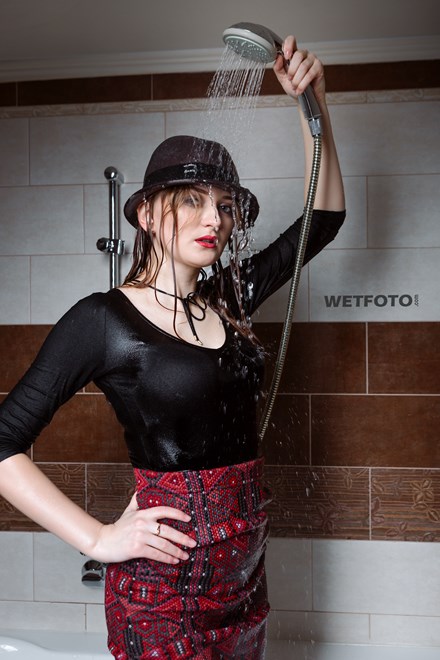 wetfoto wetlook fully clothed girl coat hat get soaking wet bubble bath