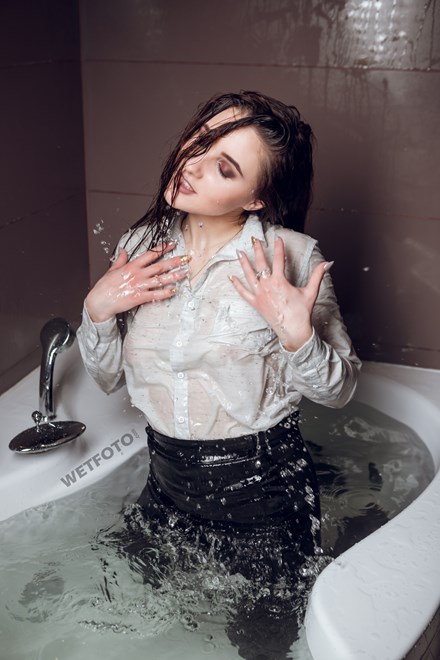 wetfoto pretty woman business suit takes shower and get wet