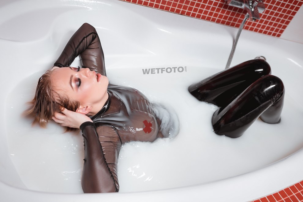 wetfoto wet girl black vinyl leggings takes milk bath