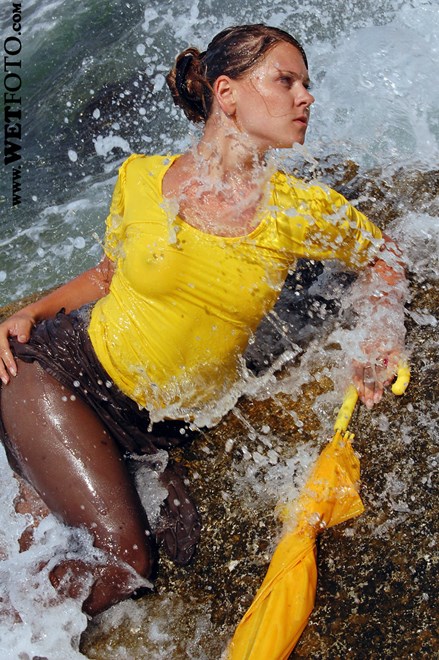 #50 - Wetlook by Bright Girl in Yellow Blouse, Skirt, Stockings and Boots at Sea