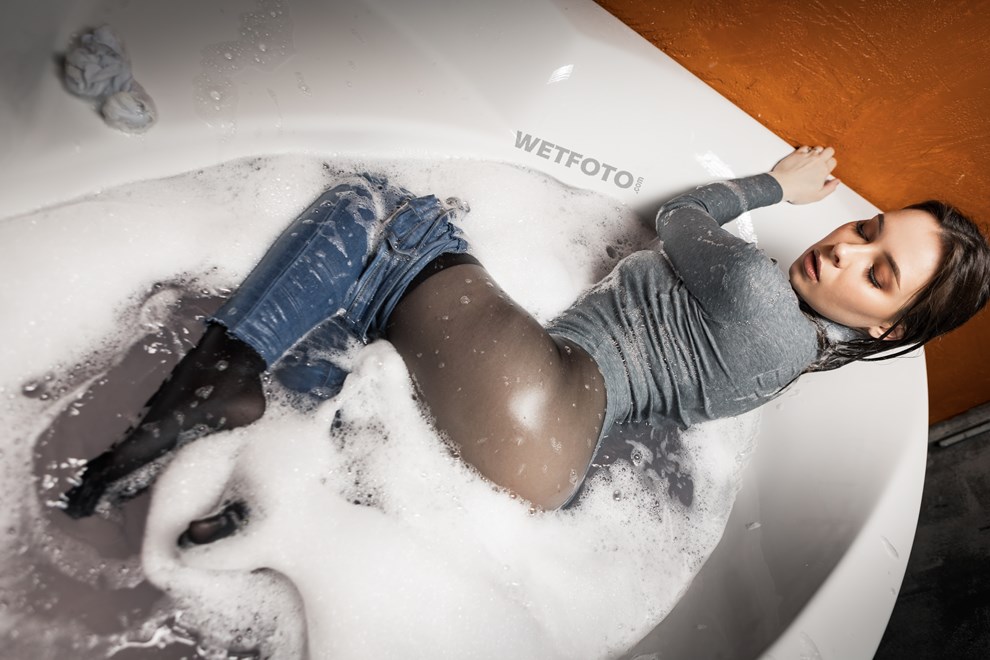 wetfoto hot woman takes bath skinny jeans bodysuit socks