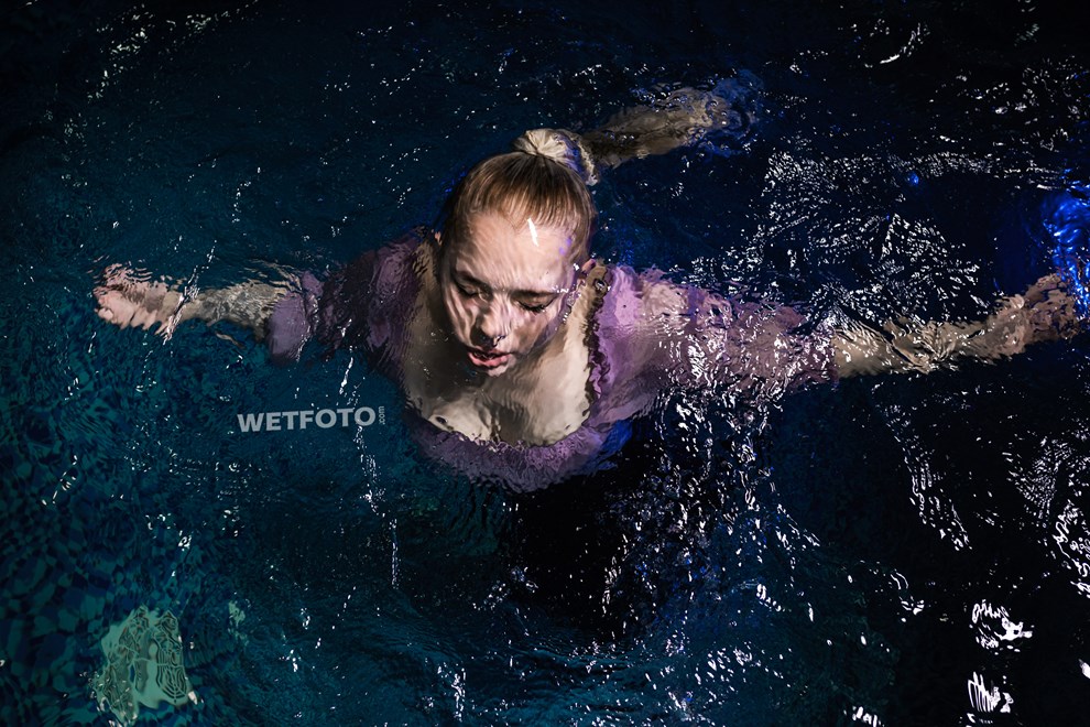 wetfoto swimming fully clothed in pool