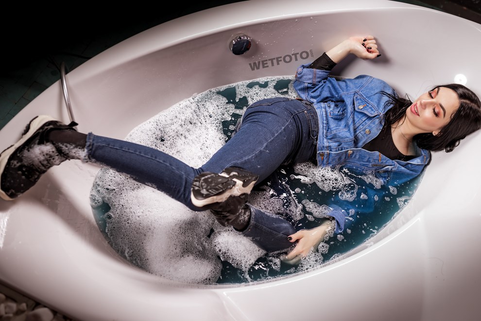 wetlook girl denim clothes takes bath wetfoto