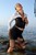 wet woman get wet wet hair fully clothed blouse skirt stockings high heels sea