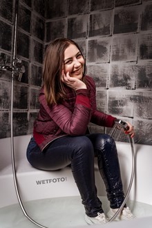 #644 - A Girl Dressed in Winter Clothes Gets Wet in the Bathtub