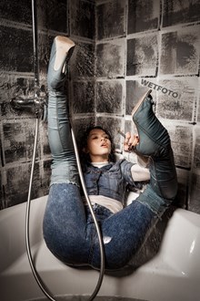 #647 - Girl in Over the Knee Denim Boots and High Waisted Skinny Jeans Gets Wet in the Bath
