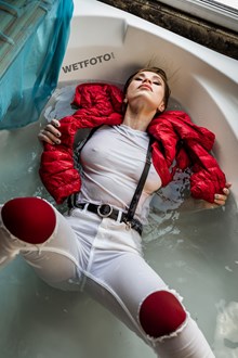 #649 - Hot Wetlook Model without a Bra Gets Wet in the Bath in White Jeans, T-shirt and Red Jacket 