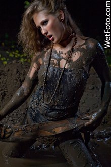 #75 - Dirty Wetlook by Wet Girl in Blue Jeans, Vest, T-Shirt and Socks in Mud