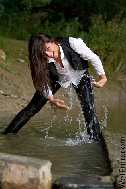wet girl get wet wet hair fully clothed leggings shirt vest leather boots lake